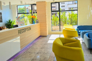 Hotel reception with yellow armchairs