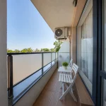 Balcony with a chair overlooking the greenery